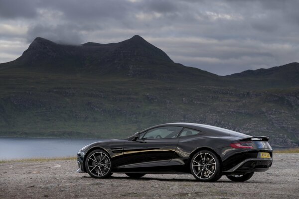 Aston Martin 2014 black near the lake