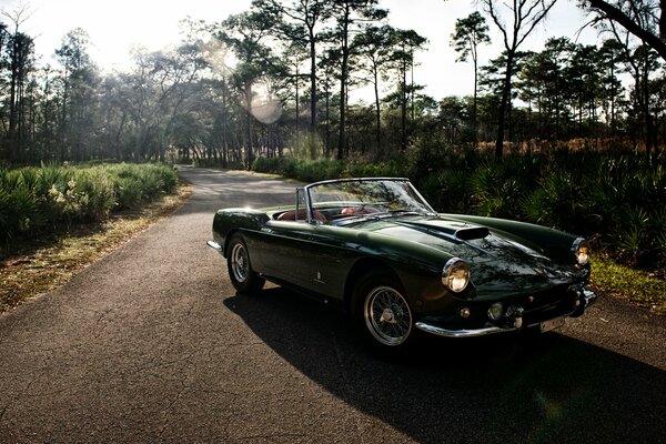 Ferrari convertible on a country road