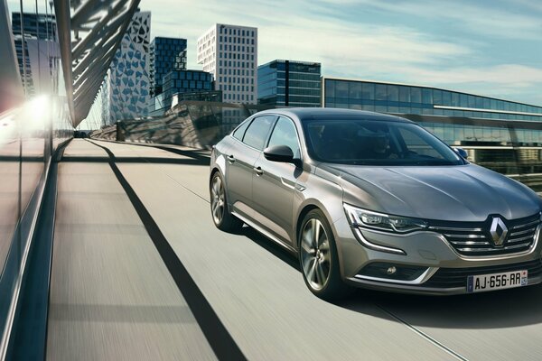 Silver renault 2015 on the background of the city