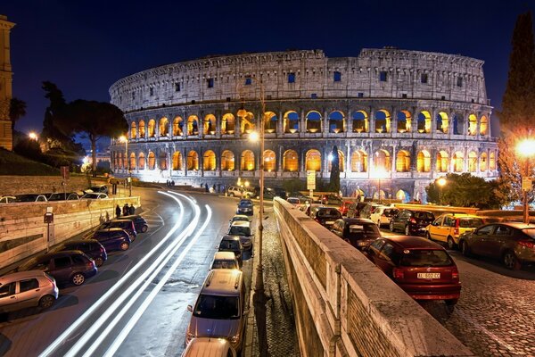 Ruins of the ancient Colosseum at night