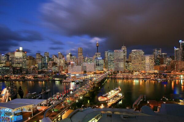 Barges and a bridge on the coast of Australia at night