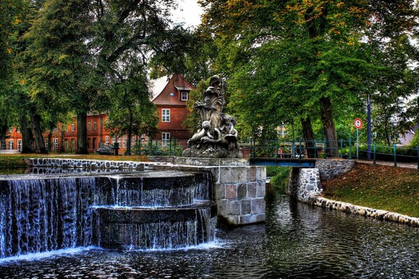 Ancient waterfalls and fantanes. Trees in the park