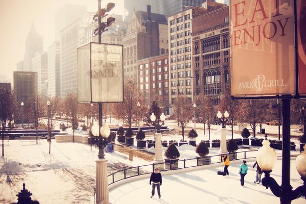 People ride on a skating rink in Chicago