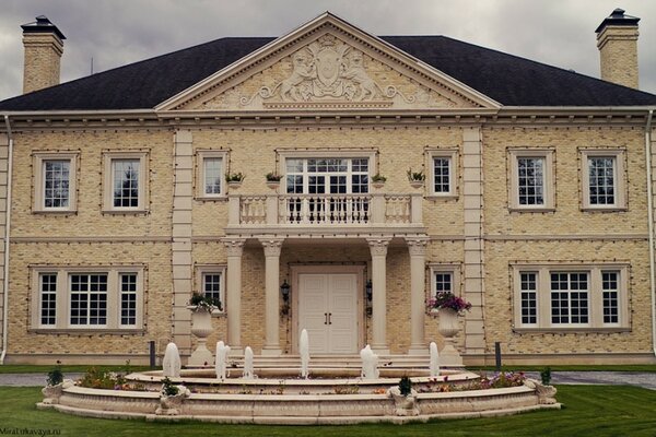 An old building with a fountain in the courtyard