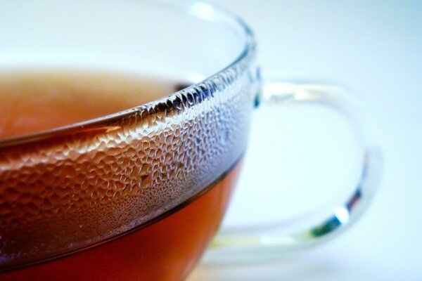 Misted transparent mug with tea