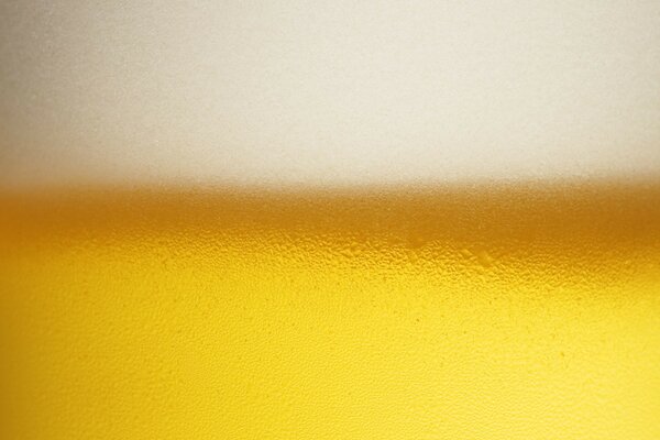 White beer bubbles on a yellow background