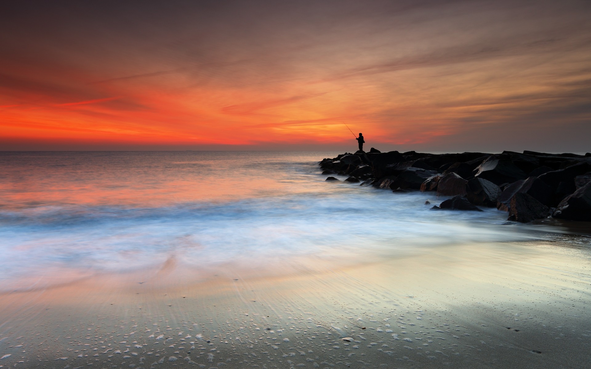 tones sea beach a fisherman