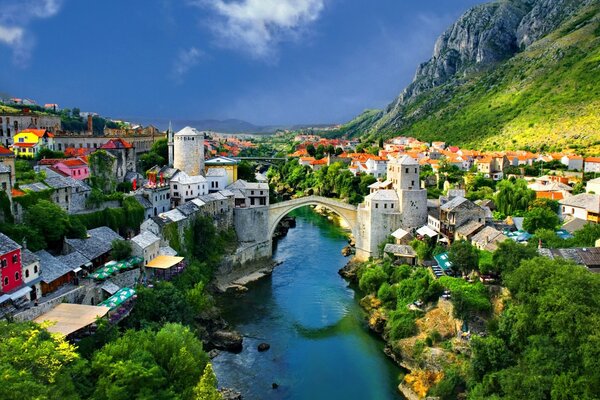 A city in the mountains, a bridge over a river