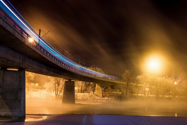 Night bridge in winter during a blizzard