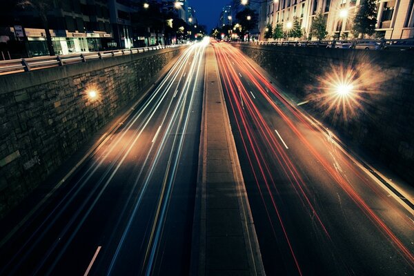 Night road in traffic cars photo with exposure