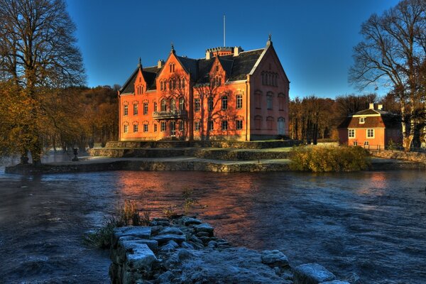 Castle on the riverbank in Sweden