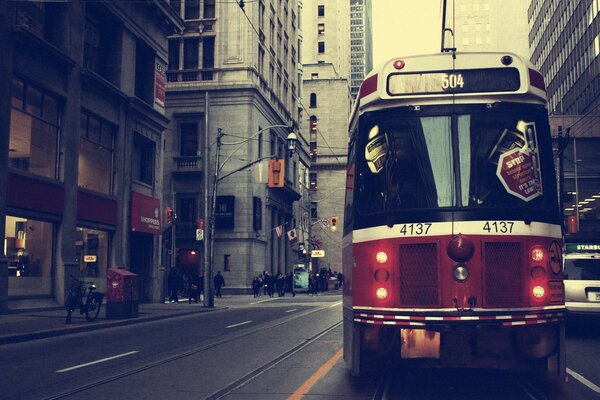 Tram rides on a city street