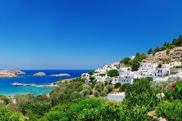 A town on the seashore on a clear day