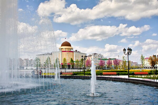 Fountains in grozny on a background of flowers