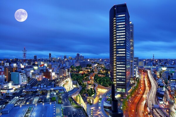 Metrópolis nocturna y edificios altos