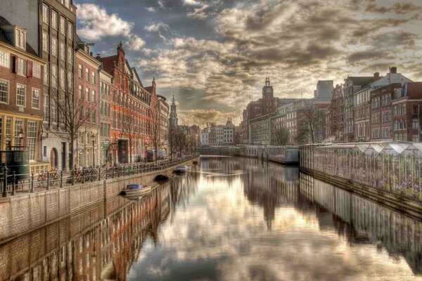 Reflection of clouds in the clear water of a river in Holland