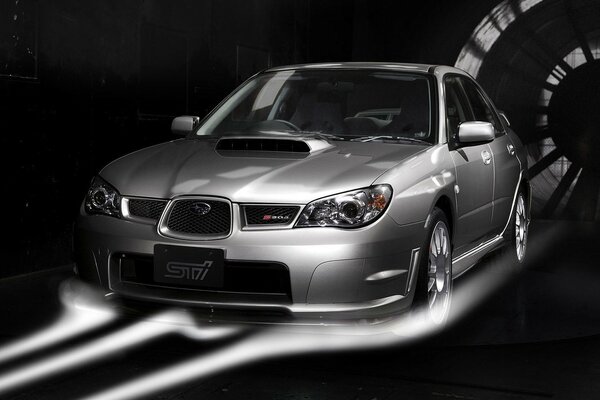 Silver subaru car on a black background