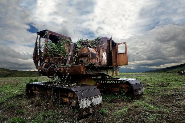 A rusty abandoned bulldozer in the woods