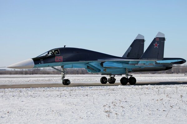 Military bomber on the background of white earth