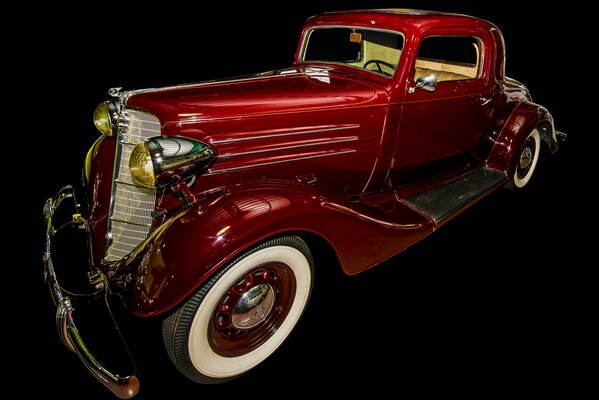 Retro car of 1935 on a black background