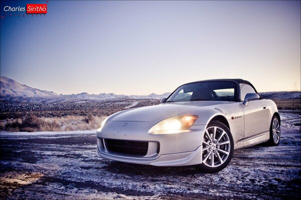 White Honda on a winter field