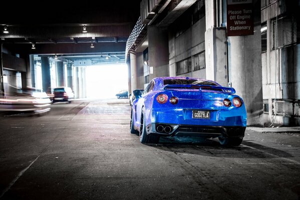 Nissan blue color standing at the column