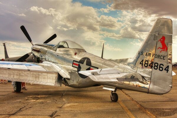 Grey Mustang plane at the airport