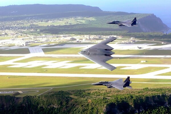 Military aircraft on the background of a beautiful landscape