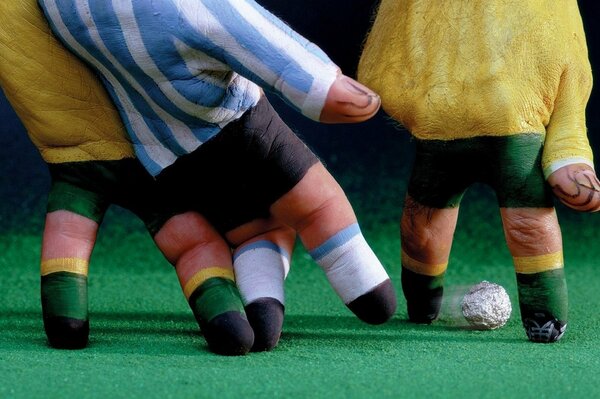 Football with painted fingers