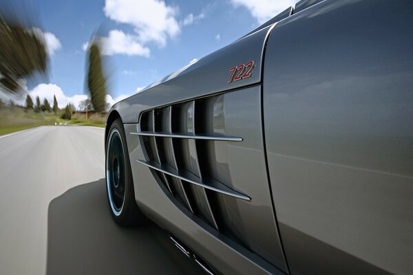 Mercedes grey car on the road background