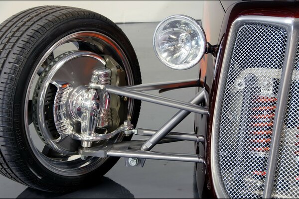 Hot road. Chrome grille with wheel