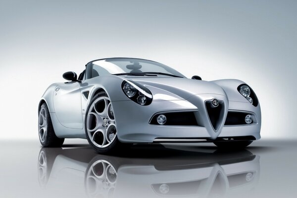 With a glassy gaze, the headlights look from the picture of a gray-haired Alfa Romeo