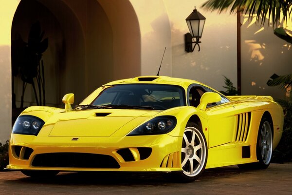 Yellow sports car at the entrance