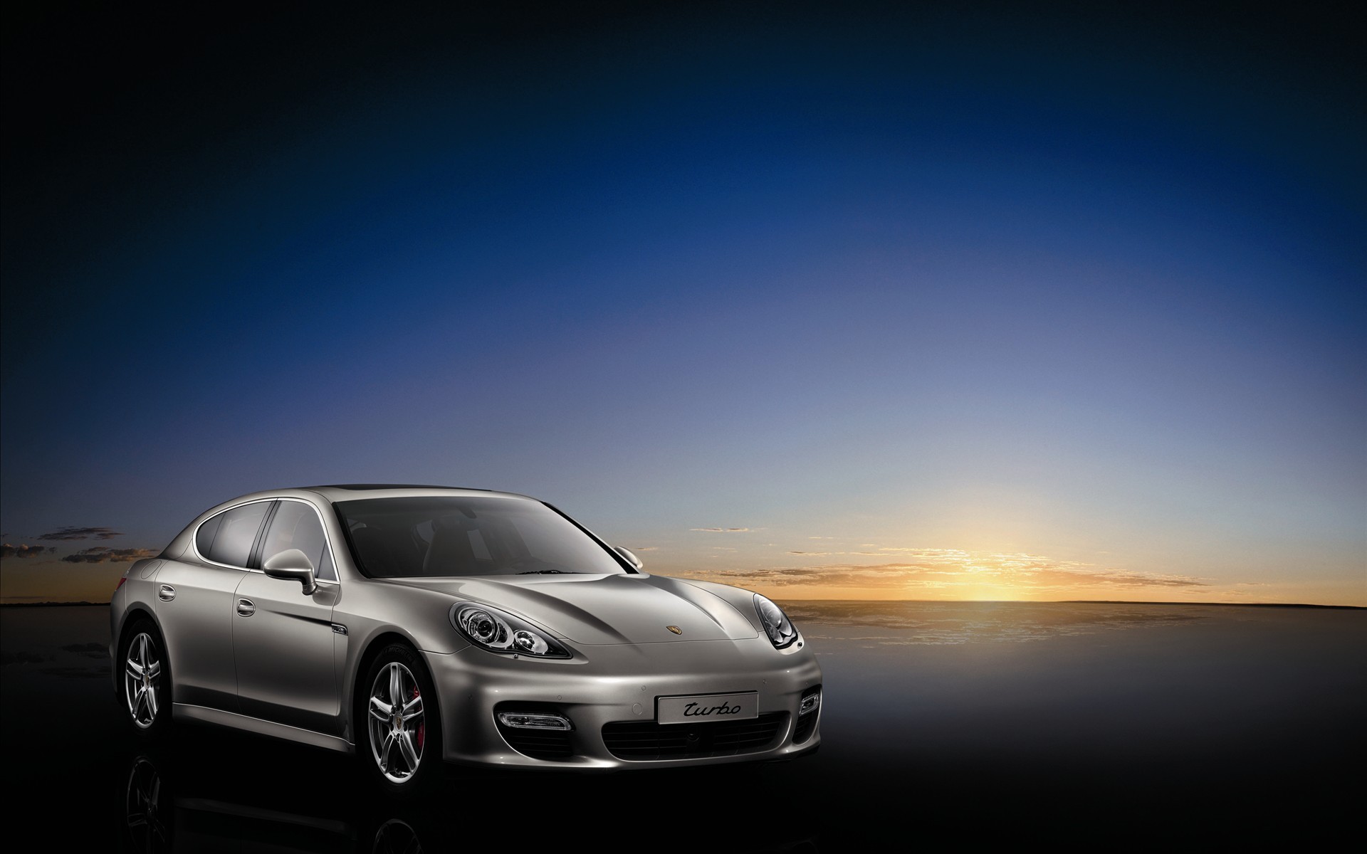 porsche argent coucher de soleil