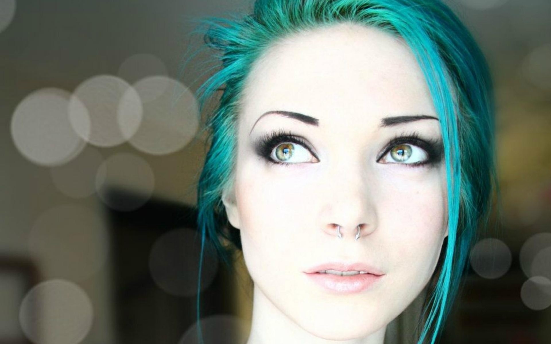 a woman girl green hair grey close up face