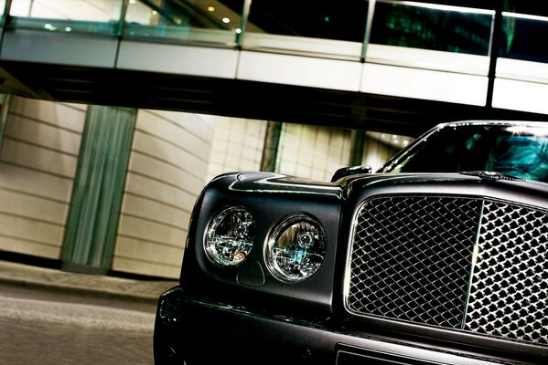 Headlights and grille of a black car