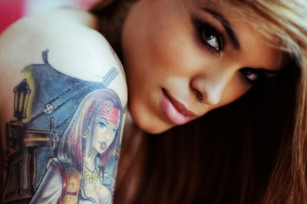 Beautiful brown-haired woman with a tattoo on her shoulder