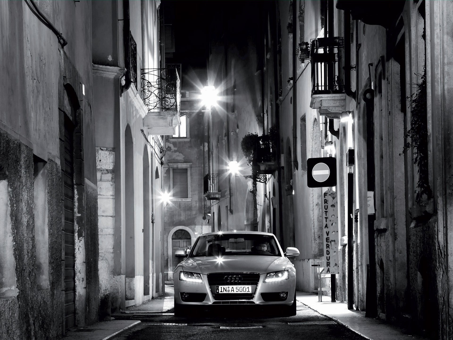 audi night street lamps black and white