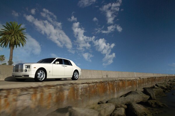 Rolls-royce phantom on the bridge under the blue sky