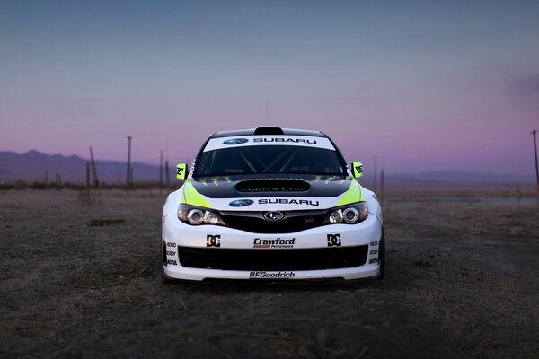 Subaru car in the evening on a lilac background