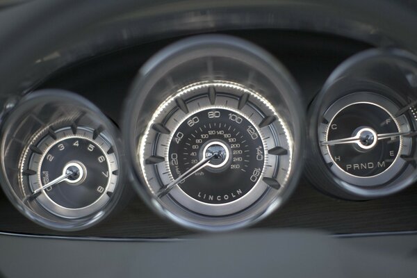 Speedometer panel with backlight near