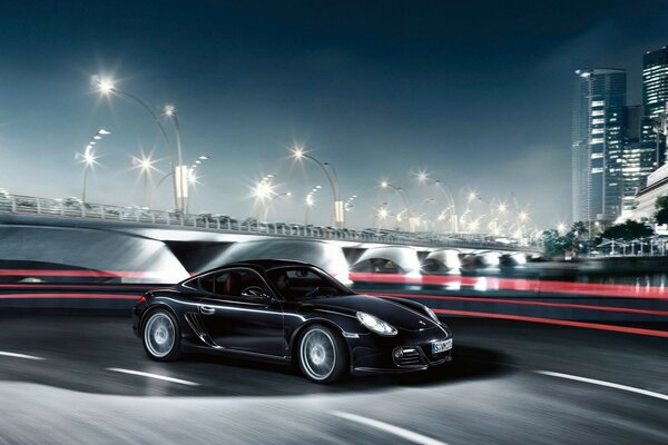 Schwarzer Porsche auf Nacht Stadt Hintergrund