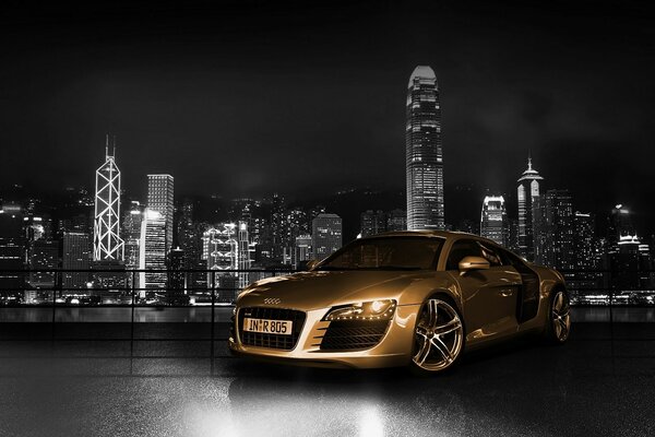 A luxury car of a golden hue against the background of a sparkling metropolis