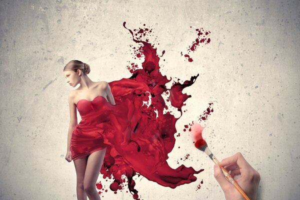 Beautiful girl in a red dress with paints