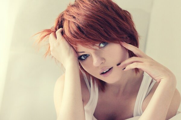 Red-haired girl with a short haircut