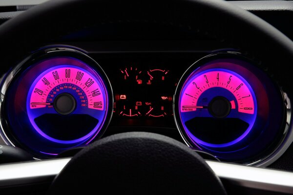 The steering wheel and speedometer of a Ford Mustang