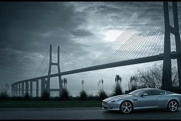 The Aston Martin DB9 company car, next to which the bridge is located