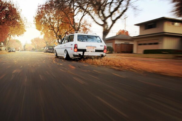 Datsun car and autumn landscape