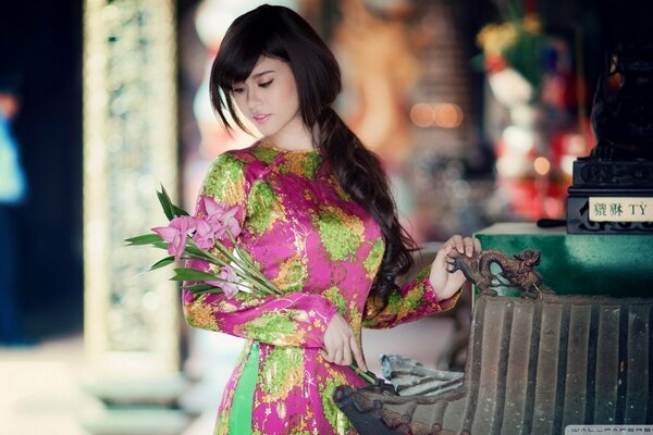 Asian girl with a bouquet of flowers