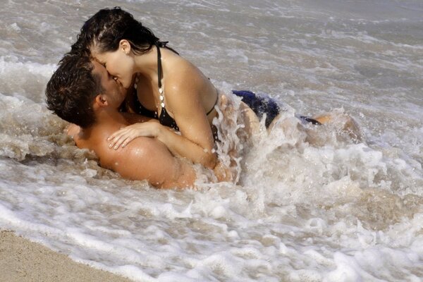 Girl with a guy on the sea relaxing